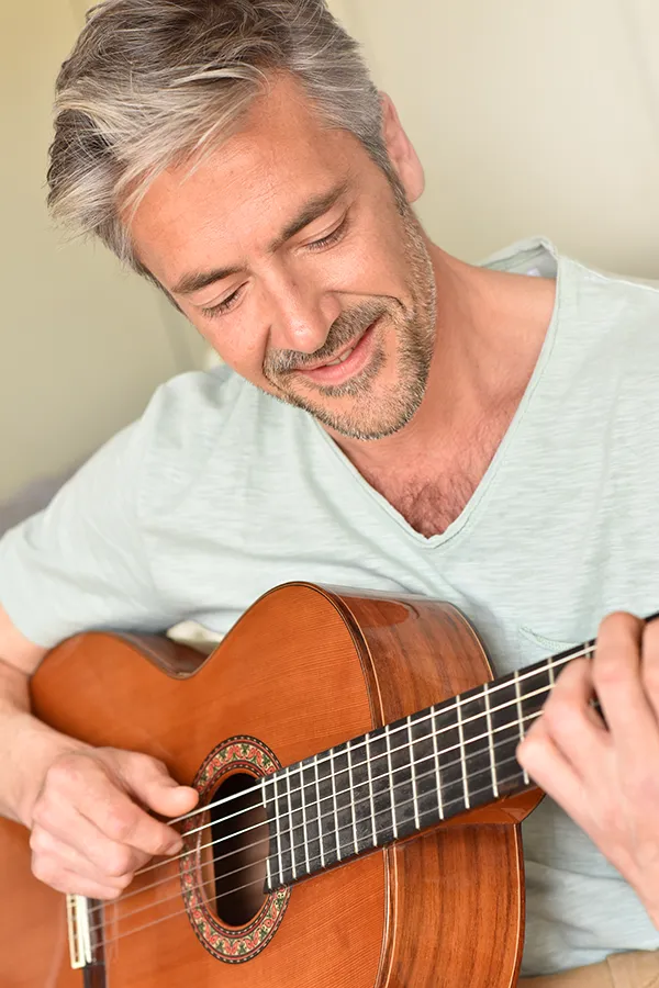 PRP-Breast-Lift-Treatment Close-up of a woman's chest wearing only a bra, showing the successful results of PRP breast lift treatment from Pierre Rojas, DO in South Lyon.